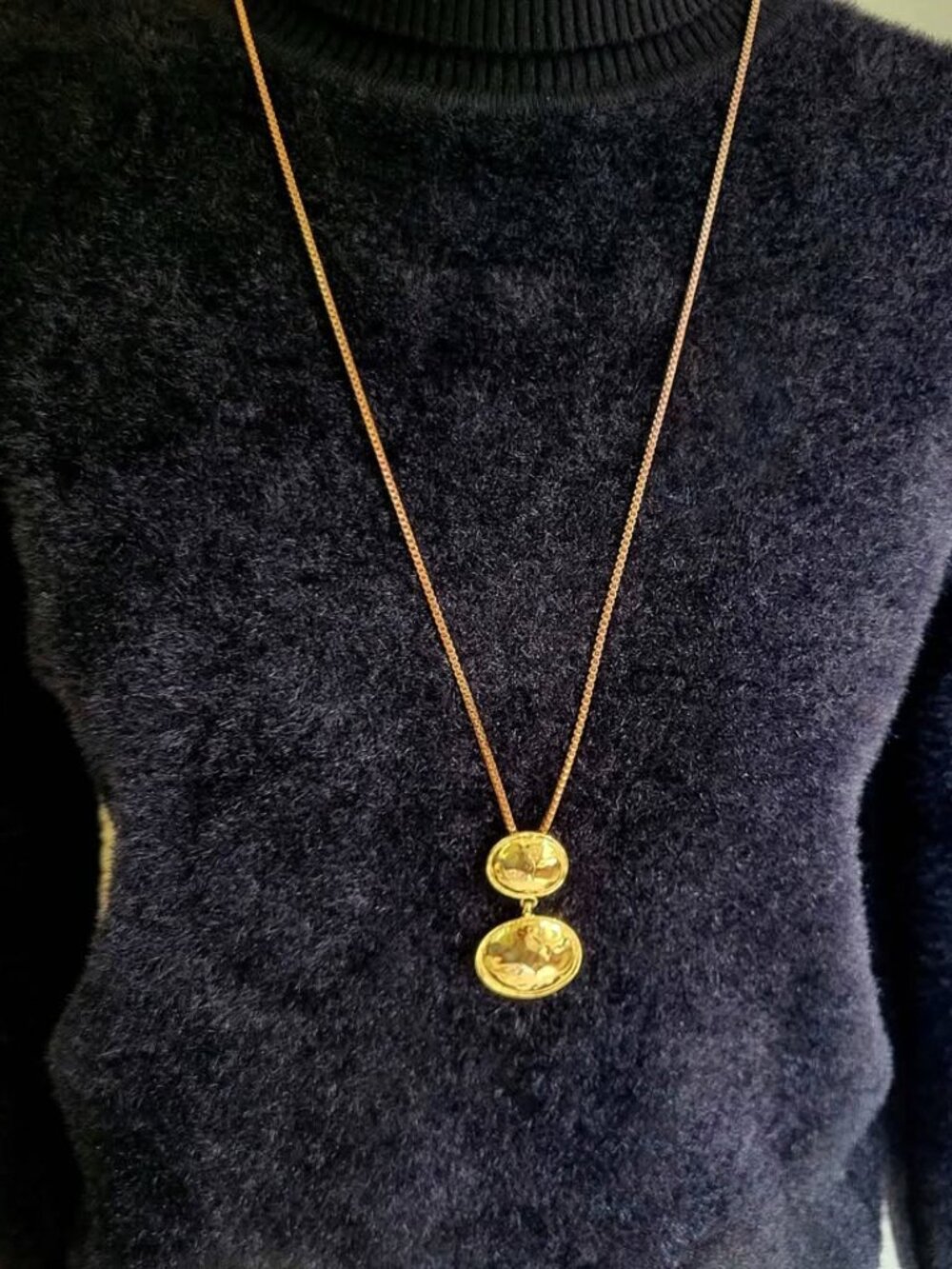 Gold-Toned Necklace Features A Double Medallion Pendant On A Long Chain